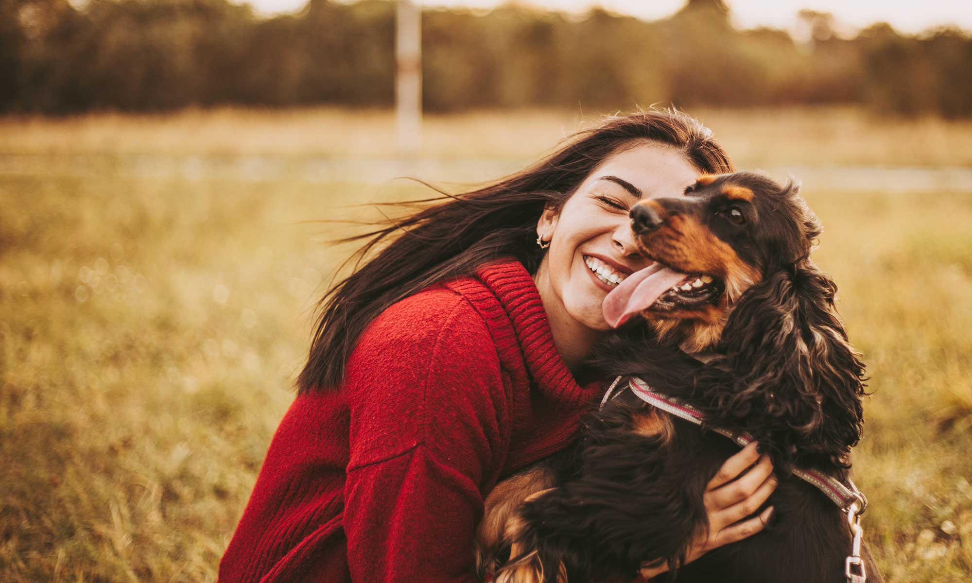 A woman with her dog outdoors